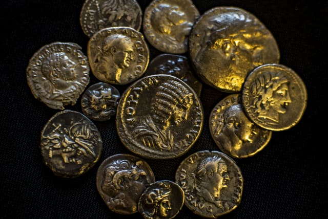  Some of the coins seized from an illegal antiquities dealer in Modi'in.  (photo credit: YOLI SCHWARTZ/IAA)