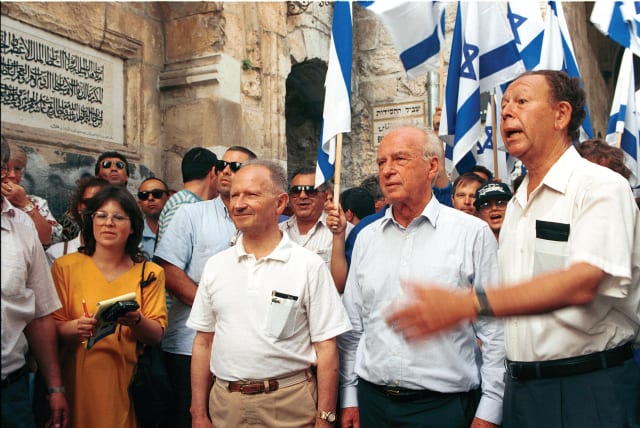  MOTTA GUR (right), the paratroop commander during the 1967 war, and Yitzhak Rabin (second from right), who had been IDF chied of staff, visit the Lions Gate in 1992 to mark the war's 25th anniversary where Israeli troops had entered the Old City.  (photo credit: FLASH90)