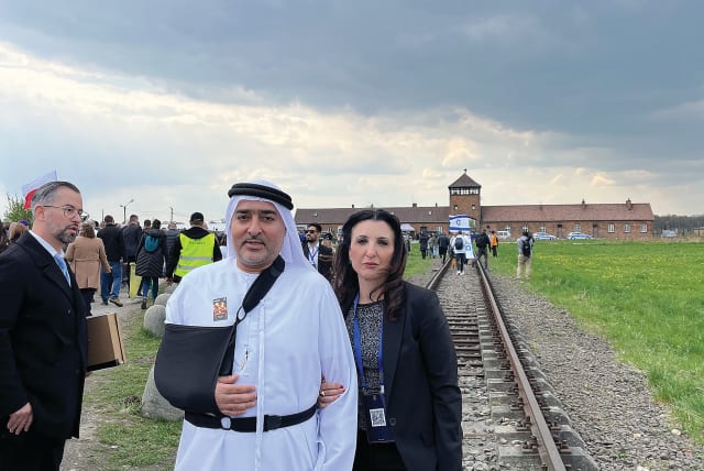  THE WRITER PARTICIPATES in the March of the Living last month on Holocaust Remembrance Day with Ahmed Obaid Al Mansoori, the first Emirati to ever take part.  (photo credit: FLEUR HASSAN-NAHOUM)
