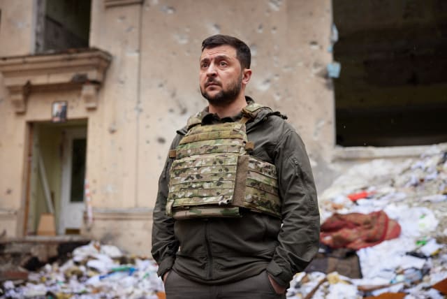 Ukraine's President Volodymyr Zelensky visits an area damaged by Russian military strikes, as Russia's attack on Ukraine continues, in Kharkiv, Ukraine May 29, 2022. (photo credit: Ukrainian Presidential Press Service/Handout via REUTERS)