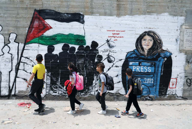  PALESTINIAN CHILDREN walk past a mural of Al Jazeera journalist Shireen Abu Akleh in Bethlehem. (photo credit: WISAM HASHLAMOUN/FLASH90)
