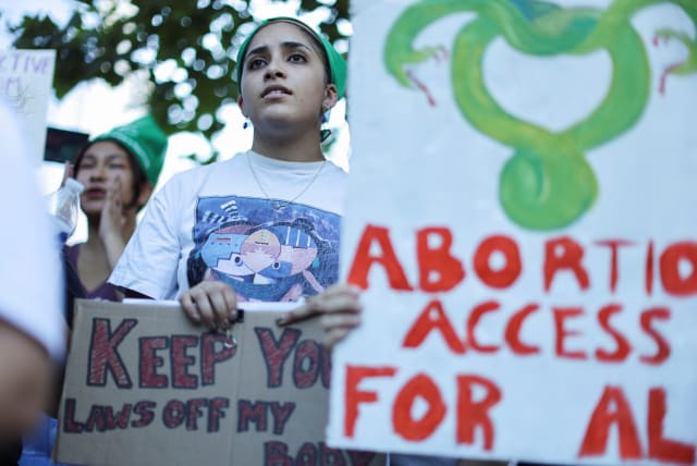  Abortion rights protesters demonstrate after the U.S. Supreme Court ruled in the Dobbs v Women’s Health Organization abortion case, overturning the landmark Roe v Wade abortion decision in Los Angeles, California, U.S., June 27, 2022. (photo credit: REUTERS/LUCY NICHOLSON)