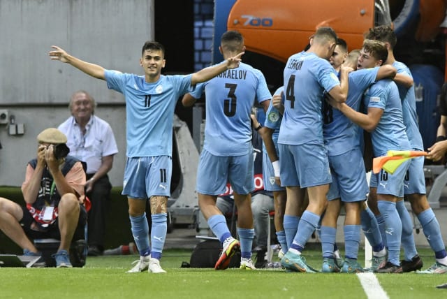 ISRAEL TEAMMATES celebrate a goal by Oscar Gloukh that, at the time, gave the blue-and-white a 1-0 lead in what ended as a 3-1 loss to England in the Under-19 European Championship final in Trnava, Slovakia. (photo credit: REUTERS/RADOVAN STOKLASA)