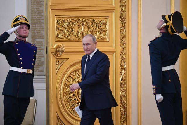 Russian President Vladimir Putin enters a hall in the Kremlin in Moscow on April 26, 2022.  (photo credit: NATALIA KOLESNIKOVA/AFP via Getty Images)