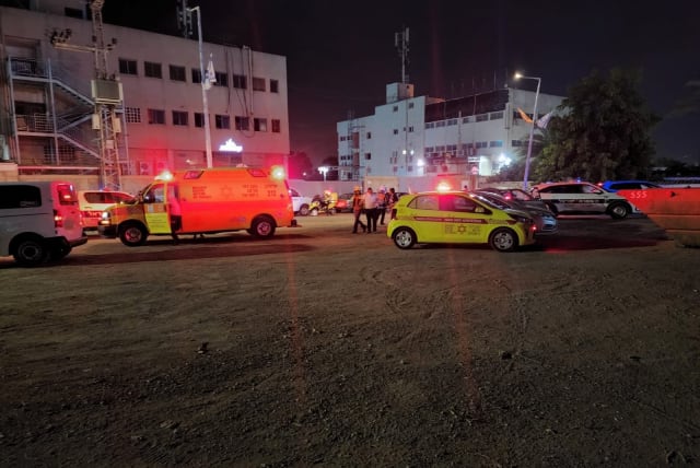  Police and Magen David Adom (MDA) personnel are on the scene of a shooting attack in Lod, Israel, on July 9, 2022. (photo credit: MDA SPOKESPERSON)