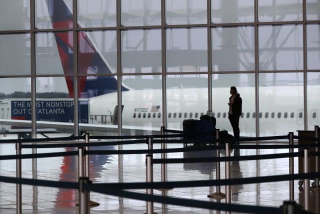  A Delta plane sits at the International Terminal at Atlanta's Hartsfield-Jackson International Airport in March 2020. (photo credit: CURTIS COMPTON/ATLANTA JOURNAL-CONSTITUTION/TNS)