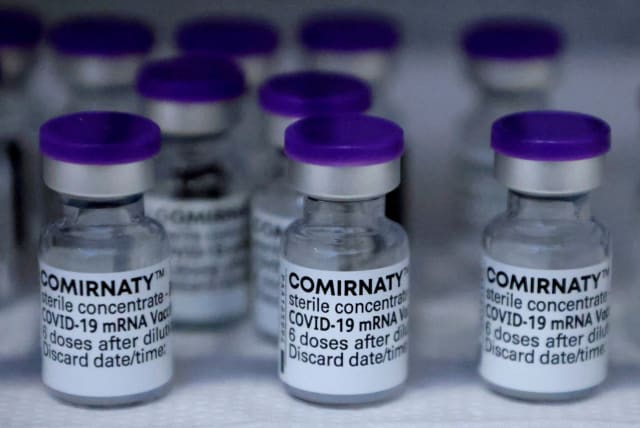  Vials of the Pfizer-BioNTech Comirnaty coronavirus disease (COVID-19) vaccine are pictured in a General practitioners practice in Berlin, Germany, April 10, 2021. (photo credit: REUTERS)