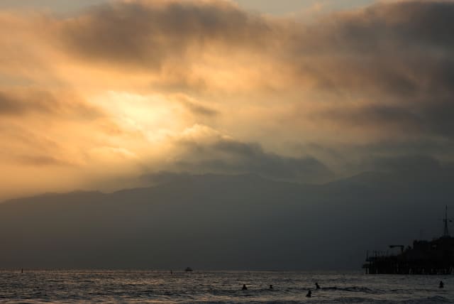  The sun sets over the Pacific Ocean on the summer solstice in Santa Monica, California, U.S., June 21, 2022. (photo credit: REUTERS/LUCY NICHOLSON)