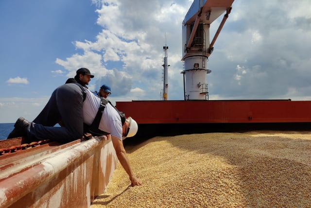 The Joint Coordination Centre officials are seen onboard Sierra Leone-flagged cargo ship Razoni, carrying Ukrainian grain, during an inspection in the Black Sea off Kilyos, near Istanbul, Turkey August 3, 2022. (photo credit: TURKISH DEFENCE MINISTRY/HANDOUT VIA REUTERS)