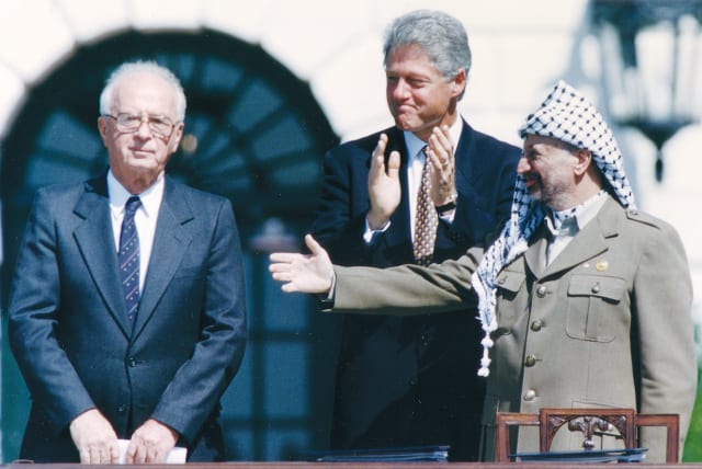  THE 1993 OSLO Accords between Israel and the PLO were signed in Washington, with a beaming president Bill Clinton presiding over the White House ceremony (photo credit: GARY HERSHORN/REUTERS)