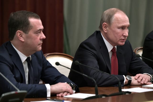  Russian President Vladimir Putin and Prime Minister Dmitry Medvedev attend a meeting with members of the government in Moscow, Russia January 15, 2020. (photo credit: SPUTNIK/ALEXEY NIKOLSKY/KREMLIN VIA REUTERS)