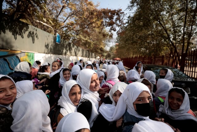  Female primary school students leave school after a class in Kabul, Afghanistan, October 25, 2021 (photo credit: REUTERS/ZOHRA BENSEMRA)