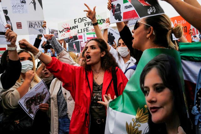  FILE PHOTO: Protesters shout slogans during a demonstration following the death of Mahsa Amini in Iran, in Istanbul, Turkey, October 2, 2022.  (photo credit: REUTERS/Dilara Senkaya/File Photo)