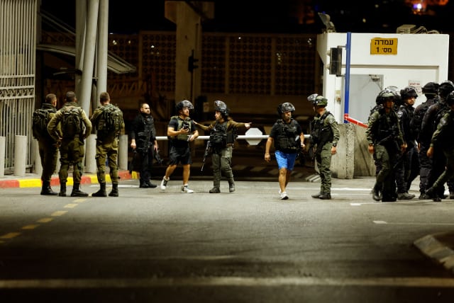  Israeli security forces are seen following a shooting incident at a check point next to Shuafat in east Jerusalem, October 10, 2022. (photo credit: AMMAR AWAD/REUTERS)