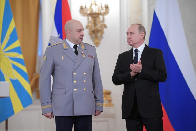  Russian President Vladimir Putin and Colonel General Sergei Surovikin, commander of Russian forces in Syria, attend a state awards ceremony for military personnel who served in Syria, at the Kremlin (photo credit: REUTERS)