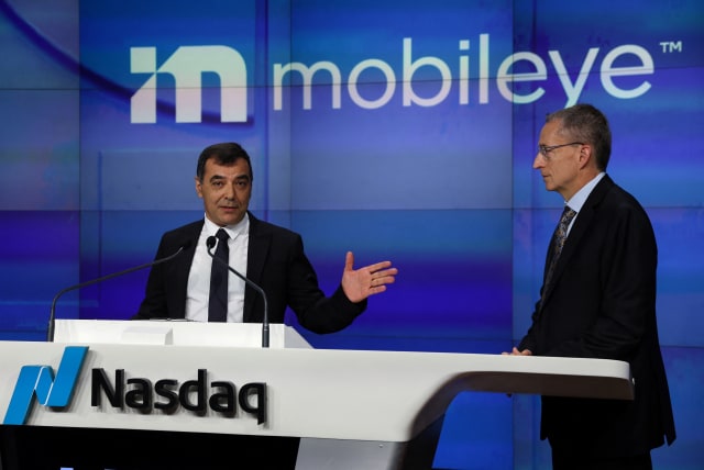  Professor Amnon Shashua, president and chief executive officer of Mobileye, speaks with Intel CEO Pat Gelsinger before ringing the opening bell for Mobileye Global Inc, at Times Square in New York City, U.S., October 26, 2022. (photo credit: REUTERS/SHANNON STAPLETON)