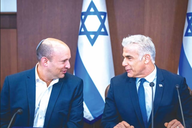  PRIME MINISTER Yair Lapid with Alternate Prime Minister Naftali Bennett at a cabinet meeting in September. (photo credit: OLIVIER FITOUSSI/FLASH90)