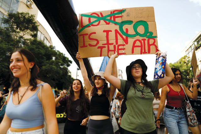  People protest against global warming in Tel Aviv on October 29, 2021.  (photo credit: CORINNA KERN/REUTERS)