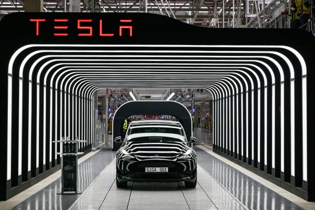   Model Y cars are pictured during the opening ceremony of the new Tesla Gigafactory for electric cars in Gruenheide, Germany, March 22, 2022. (photo credit: Patrick Pleul/Pool/REUTERS)