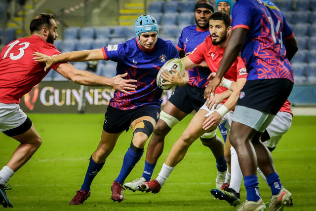 The Tel Aviv Heat (in blue) has been a success, both on and off the pitch, as it helps reignite the spirit of rugby throughout Israel. (photo credit: TSAHI REIZEL/COURTESY)