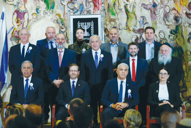  PRESIDENT ISAAC Herzog and Prime Minister Yair Lapid sit at the center of the front row, with MK Benjamin Netanyahu behind them, in a Knesset inauguration photo earlier this month. Herzog emphasized that Israelis are exhausted from infighting. (photo credit: OLIVIER FITOUSSI/FLASH90)