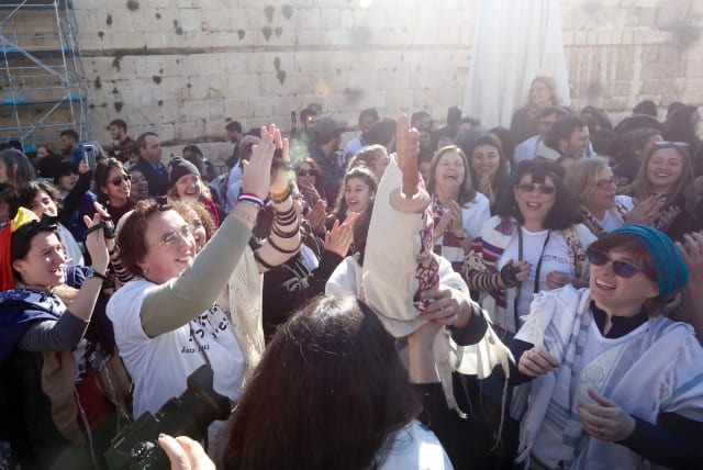  Women of the Wall celebrate after regrouping at the Egalitarian Section of the Western Wall in 2019. (photo credit: MARC ISRAEL SELLEM)
