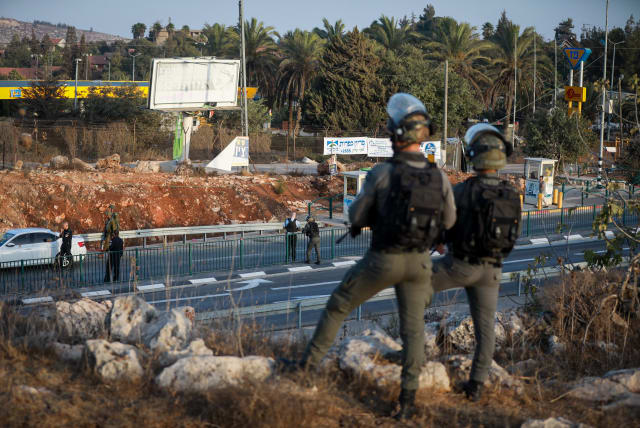 Israeli soldiers guard in a bus station at the entrance to the Israeli settlement of Ofra, where a Palestinian man tried to ram Israeli security forces who stopped him for inspection, October 4, 2022. (photo credit: FLASH90)