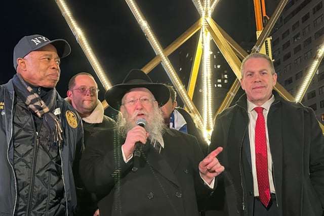 NYC Mayor Eric Adams, Israel's UN Ambassador Gilad Erdan light world's tallest menorah on the first night of Hanukkah in Manhattan.  (photo credit: PERMANENT MISSION OF ISRAEL TO THE UN)