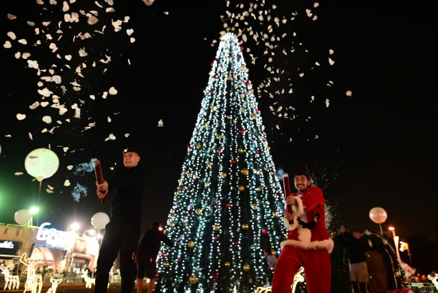  People at the Annual Christmas Tree Lighting ceremony in Jaffa, December 19, 2022.  (photo credit: TOMER NEUBERG/FLASH90)