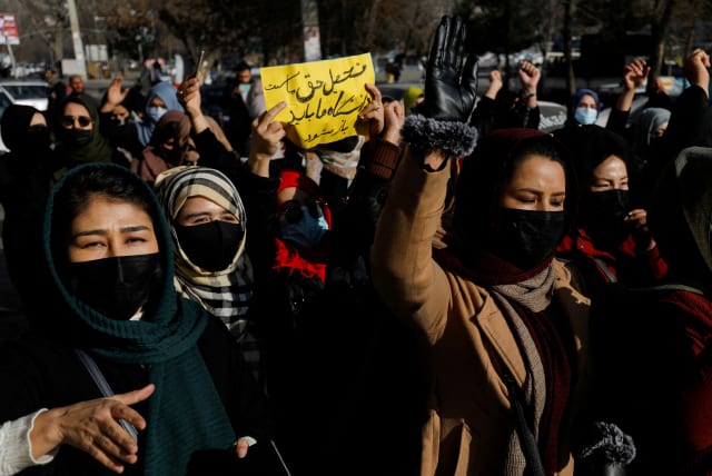 Afghan women chant slogans in protest against the closure of universities to women by the Taliban in Kabul, Afghanistan, December 22, 2022. (photo credit: REUTERS/STRINGER)