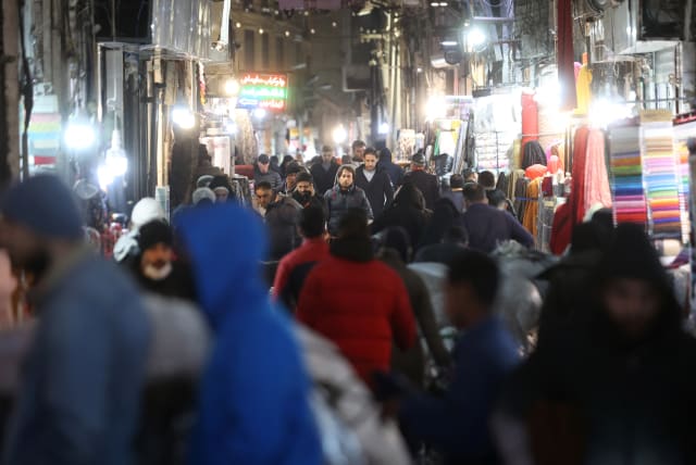 Iranians walk through Tehran Bazaar, in Tehran, Iran December 5, 2022. (photo credit: MAJID ASGARIPOUR/WANA (WEST ASIA NEWS AGENCY) VIA REUTERS)