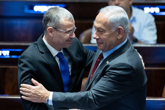  Likud Head MK Benjamin Netanyahu speaks with MK Yariv Levin during a vote for the new Knesset speaker at the assembly hall of the Knesset, the Israeli parliament in Jerusalem, on December 13, 2022. (photo credit: YONATAN SINDEL/FLASH90)