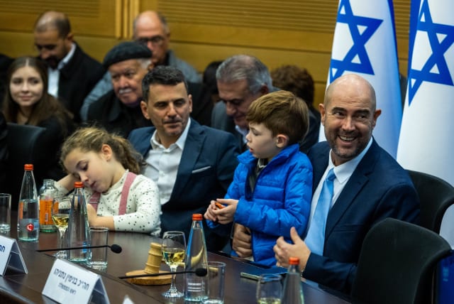 Knesset Speaker Amir Ohana with his husband and children at a Likud faction meeting following the swearing in of the new government, December 29, 2022. (photo credit: OREN BEN HAKOON/FLASH90)