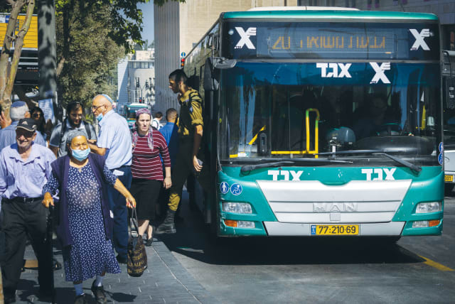  A BUS STOPS outside the Central Bus Station in Jerusalem.  (photo credit: OLIVIER FITOUSSI/FLASH90)