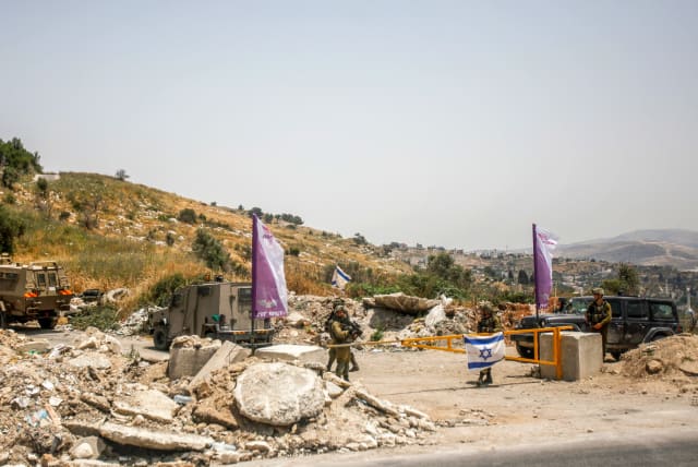 Israeli soldiers block the entrance to Homesh in the West Bank on May 28, 2022. (photo credit: NASSER ISHTAYEH/FLASH90)