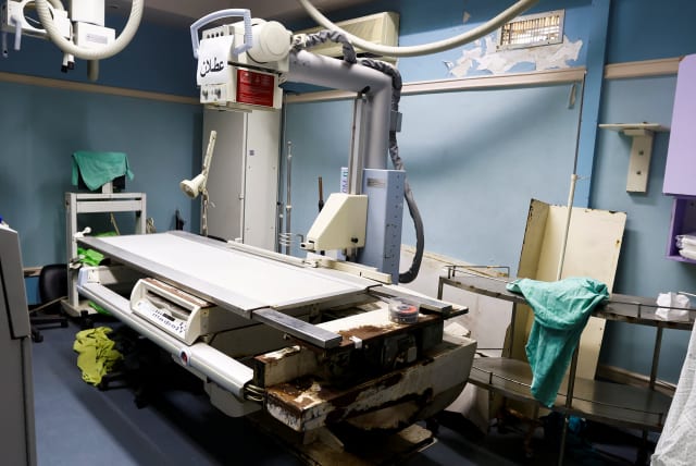  A view of a broken X-ray machine at Shifa hospital in Gaza City, January 5, 2023.  (photo credit: IBRAHEEM ABU MUSTAFA/REUTERS)