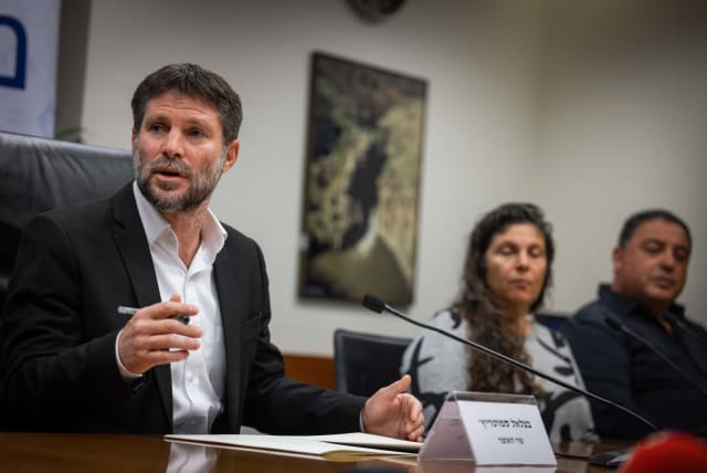  Finance Minister Bezalel Smotrich holds a press conference with bereaved families at the Israeli Finance Ministry in Jerusalem on January 8, 2023. (photo credit: YONATAN SINDEL/FLASH90)