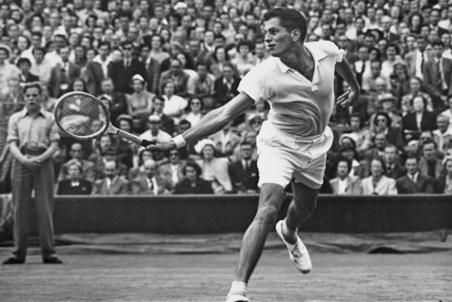  DICK SAVITT makes a backhand return to compatriot Herbie Flam during their semi-final match at Wimbledon on July 6, 1951. (photo credit: CENTRAL PRESS/HULTON ARCHIVE/GETTY IMAGES)