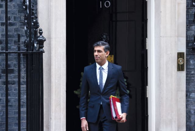  British Prime Minister Rishi Sunak exiting 10 Downing Street on December 14, 2022.  (photo credit: HENRY NICHOLLS/REUTERS)