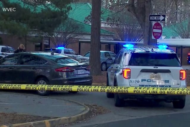  Police vehicles are seen parked outside Richneck Elementary School, where according to the police, a six-year-old boy shot and wounded a teacher, in Newport News, Virginia, U.S., January 6, 2023, (photo credit: WVEC VIA ABC/HANDOUT VIA REUTERS)