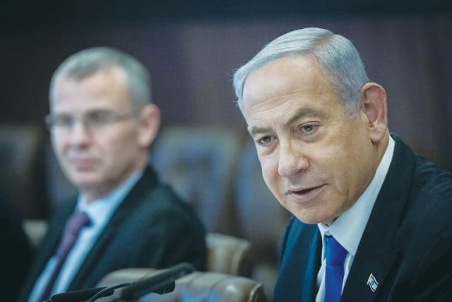  PRIME MINISTER Benjamin Netanyahu holds last Sunday’s cabinet meeting at the Prime Minister’s Office in Jerusalem, as Justice Minister Yariv Levin looks on.  (photo credit: YONATAN SINDEL/FLASH90)
