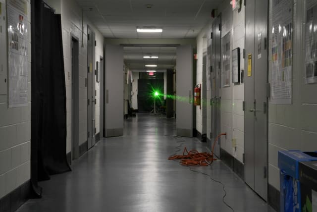  A laser is sent down a UMD hallway in an experiment to corral light as it makes a 45-meter journey. (photo credit: INTENSE LASER-MATTER INTERACTIONS LAB, UMD)
