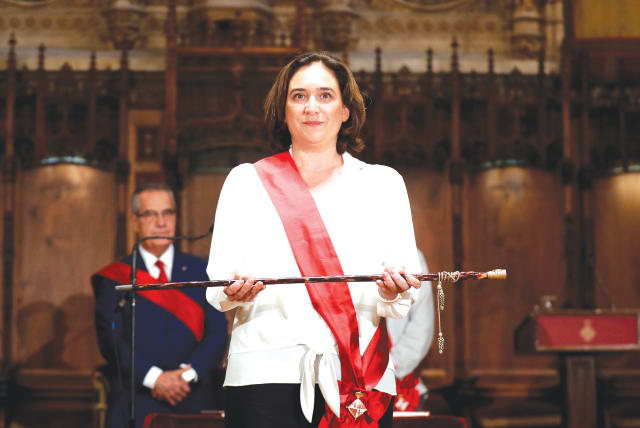  ADA COLAU poses during her swearing-in ceremony as the new mayor of Barcelona, in 2019. (photo credit: ALBERT GEA/ REUTERS)