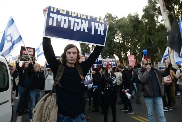   Students and faculty at Kibbutzim College of Education, Technology and the Arts take to the streets to protest the judicial reforms being discussed in the Israeli government on January 26, 2023.  (photo credit: AVSHALOM SASSONI/MAARIV)