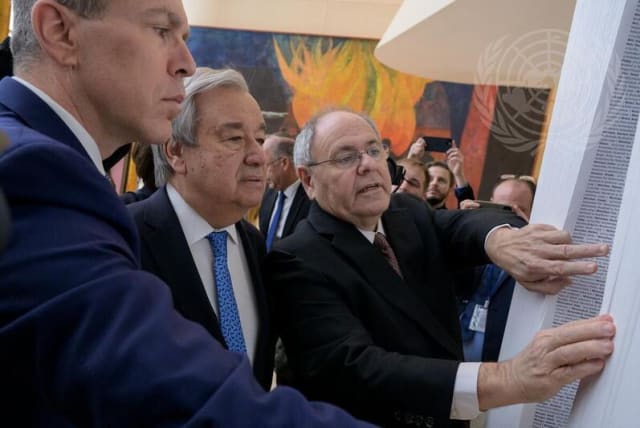  Secretary General Antonio Guterres and Yad Vashem Chairman Dani Dayan inaugurate the Book of Names at UN headquarters in NYC. (photo credit: UN)