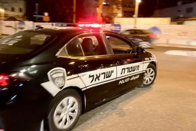  A police car at night. (photo credit: AVSHALOM SASSONI)