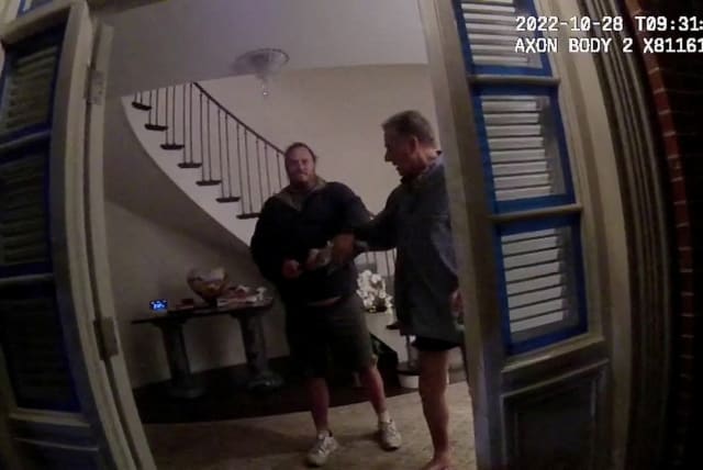  A screenshot from a police body camera video shows David DePape holding onto Paul Pelosi, the husband of then-House Speaker Nancy Pelosi, in the couple’s house on October 28, 2022, in San Francisco (photo credit: District Attorney/Handout via REUTERS)
