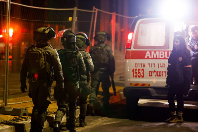  Israeli security forces and rescue forces at the scene of a shooting attack in Neve Yaakov, Jerusalem, January 27, 2023. (photo credit: OLIVIER FITOUSSI/FLASH90)