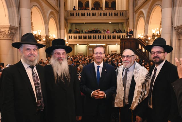  PRESIDENT Isaac Herzog with dignitaries of Belgium’s Jewish community at the Great Synagogue of Europe.  (photo credit: CHAIM TZACH/GPO)