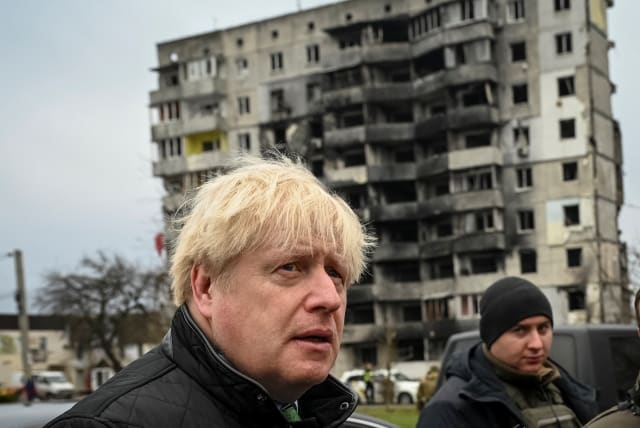  Former British Prime Minister Boris Johnson visits the town of Borodianka, heavily damaged during Russia's invasion of Ukraine, outside of Kyiv, Ukraine January 22, 2023.  (photo credit: REUTERS/Viacheslav Ratynskyi)